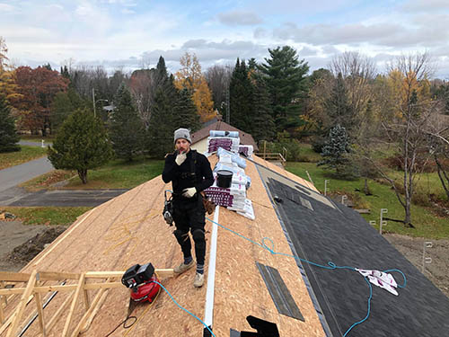 A West Island-style roof stripped to the deck, with new membrane going on