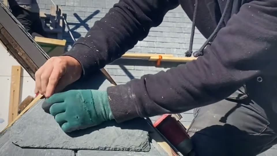 Fish-scale slate on a dormer, cut and laid by hand