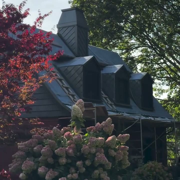Zinc dormers and chimney on a Montreal home