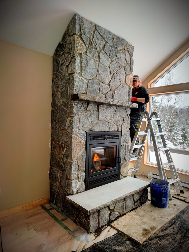 Stone fireplace built by Maximum Precision